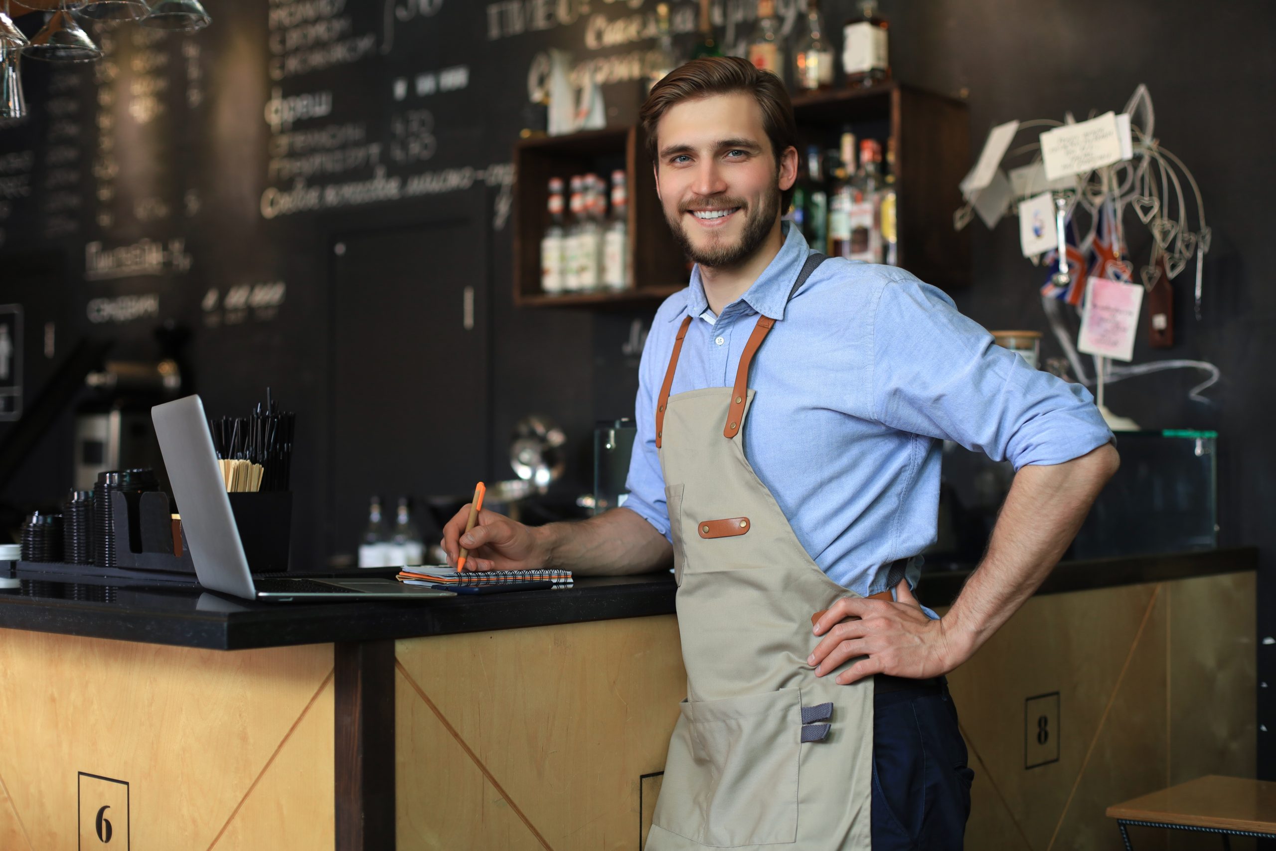 Small business owner working at his cafe